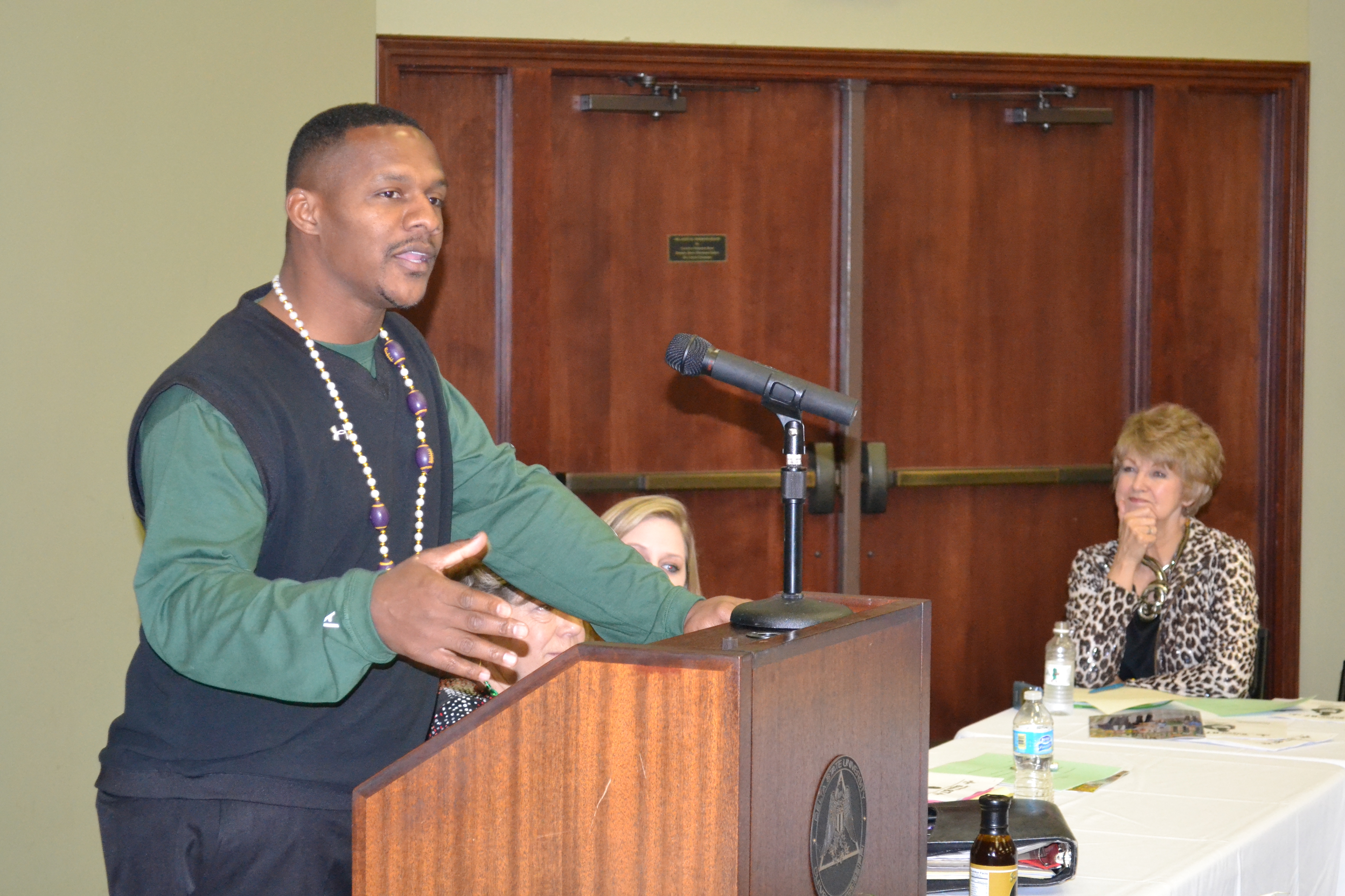 PHOTO:  Former New Orleans Saints wide receiver Joe Horn speaks during a round table discussion on raising money for scholarships hosted by the Delta State University Alumni and Foundation as Delta State’s Director of Donor Relations Ann Giger looks on. 